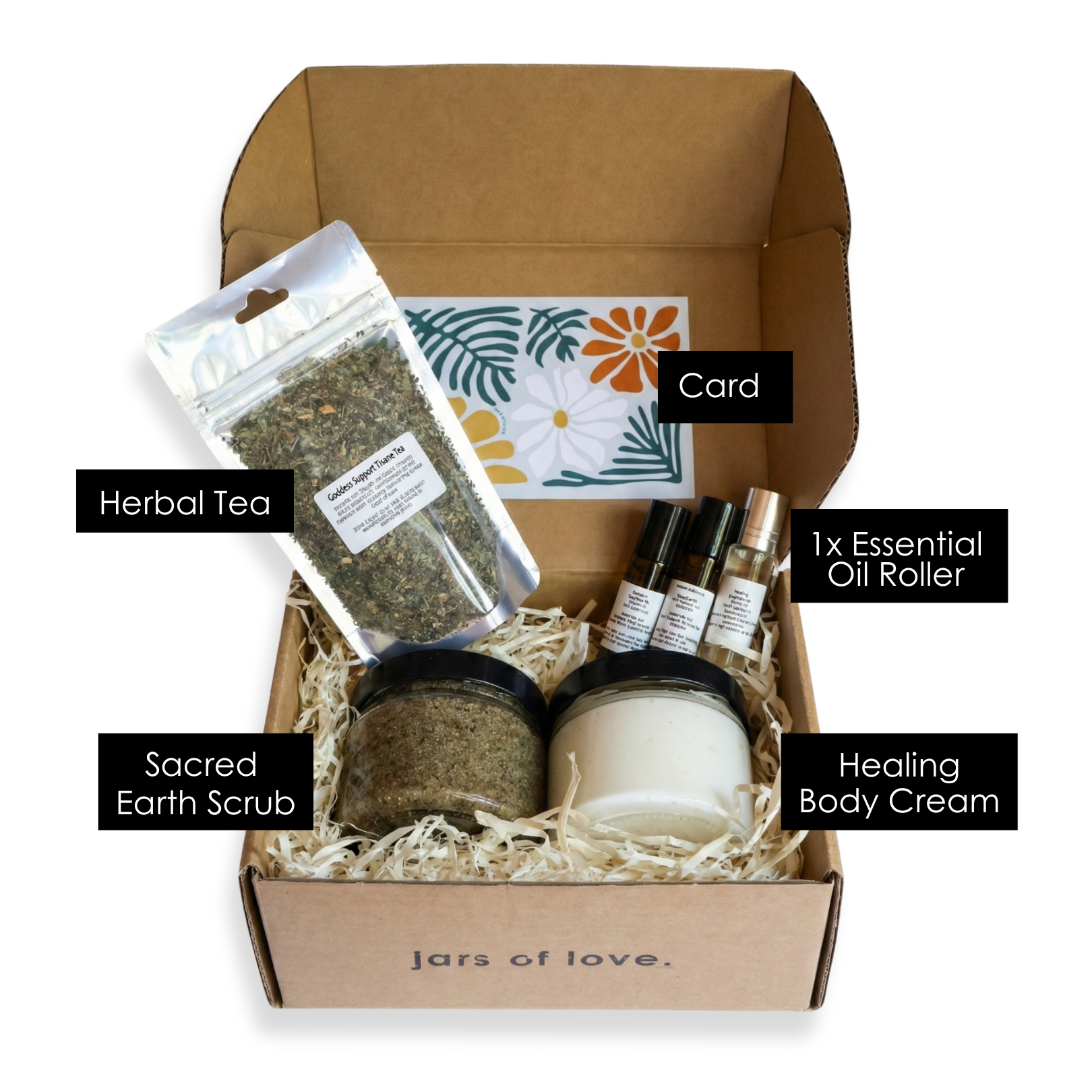 Box of self-care products including herbal tea, scrub, card, essential oil roller, and cream with 'Jars of Love' branding.